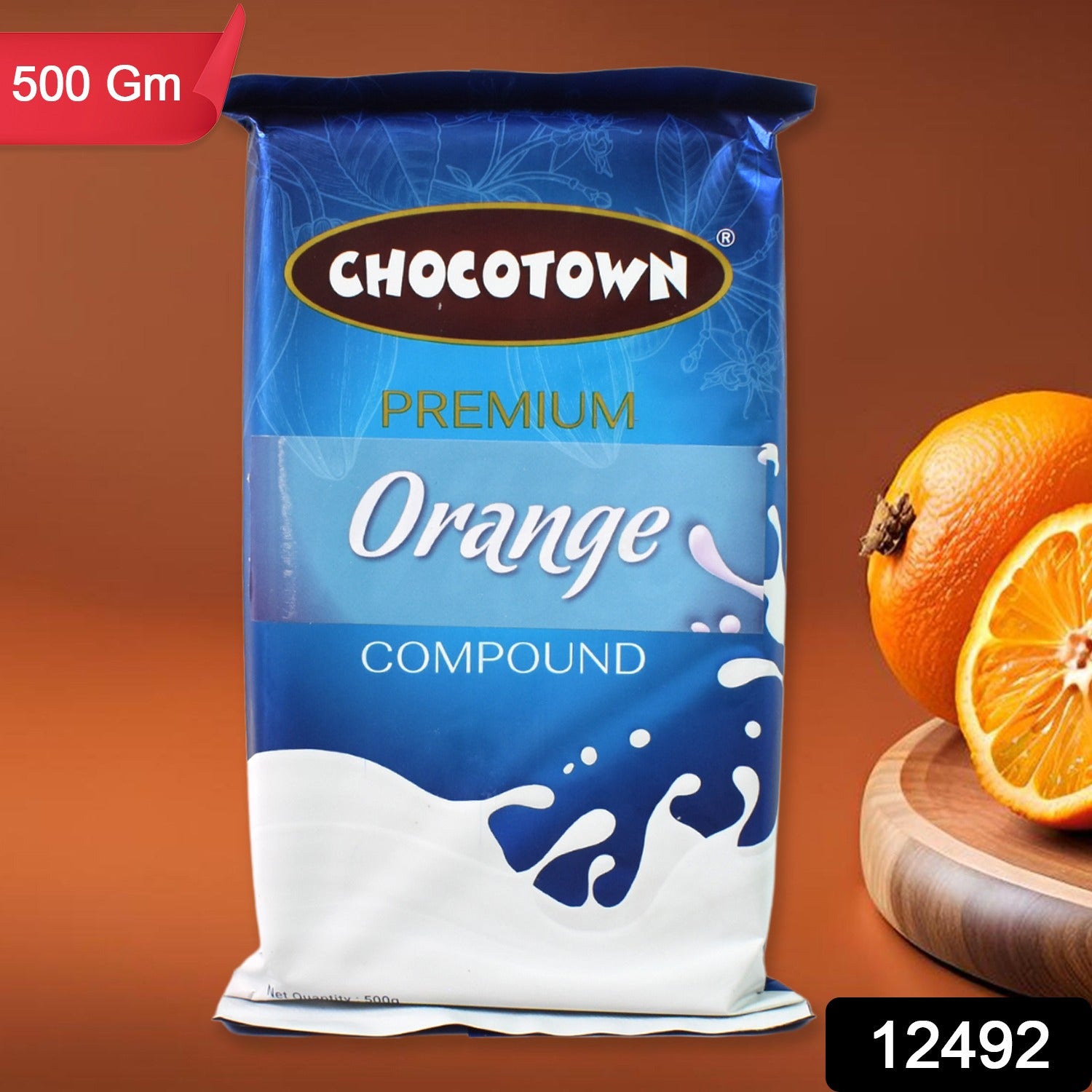 Wukusy Chocotown Premium Orange Compound 500g, vibrant orange-colored chocolate coating for baking and confectionery uses.
