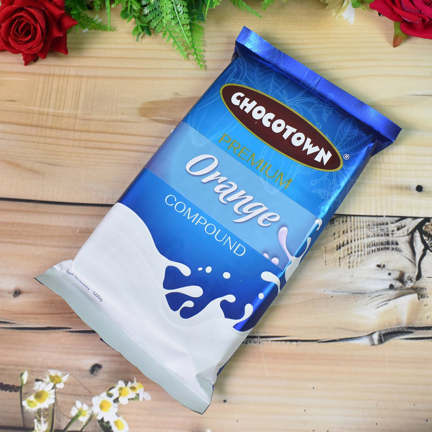 Wukusy Chocotown Premium Orange Compound 500g, a bright orange flavored confectionery ingredient for baking and desserts.