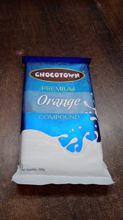 Wukusy Chocotown Premium Orange Compound 500g, creamy orange-flavored chocolate for baking and dessert making.