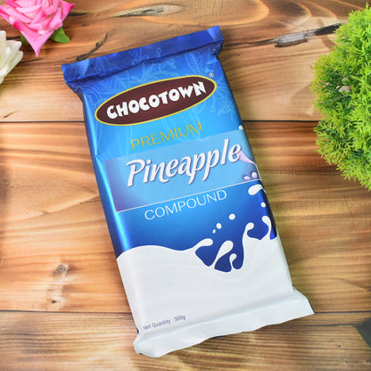 Wukusy Chocotown Premium Pineapple Compound 500g jar, showing the tropical fruit flavor and packaging on a food product label.