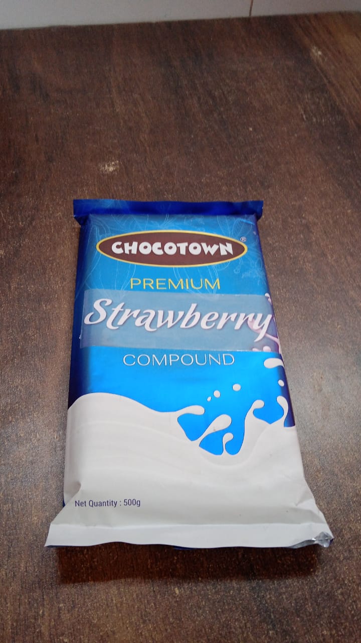 Wukusy Chocotown Premium Strawberry Compound 500g jar, showcasing the smooth pink strawberry-flavored food paste.