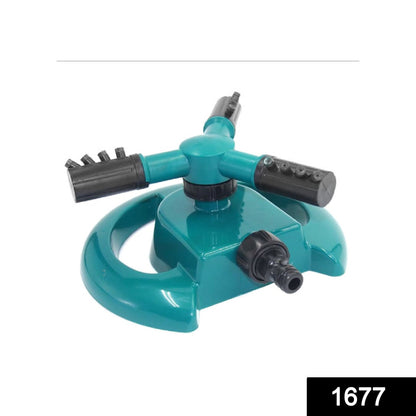 Wukusy 1677 3-arm 360-degree rotating water sprinkler for garden irrigation, attached to garden hose in yard setting.