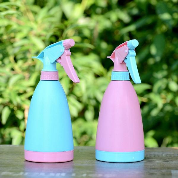 Wukusy garden water spray bottle for home and garden use, with a clear plastic container and adjustable nozzle.