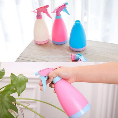 Wukusy garden water spray bottle, multipurpose home and garden tool, clear plastic container with adjustable nozzle for watering plants.
