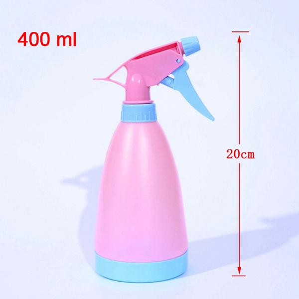 Wukusy garden water spray bottle, versatile for home and garden use, with a clear plastic container and spray nozzle.