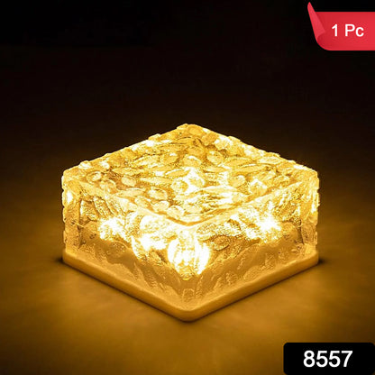 Wukusy ice cube-shaped solar garden light emitting warm glow, ideal for walkways, pathways, backyard, and holiday outdoor decor.