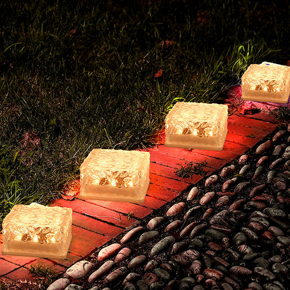 Wukusy ice cube-shaped solar garden light emitting warm glow, ideal for walkway, pathway, backyard, Christmas, and outdoor party decor.