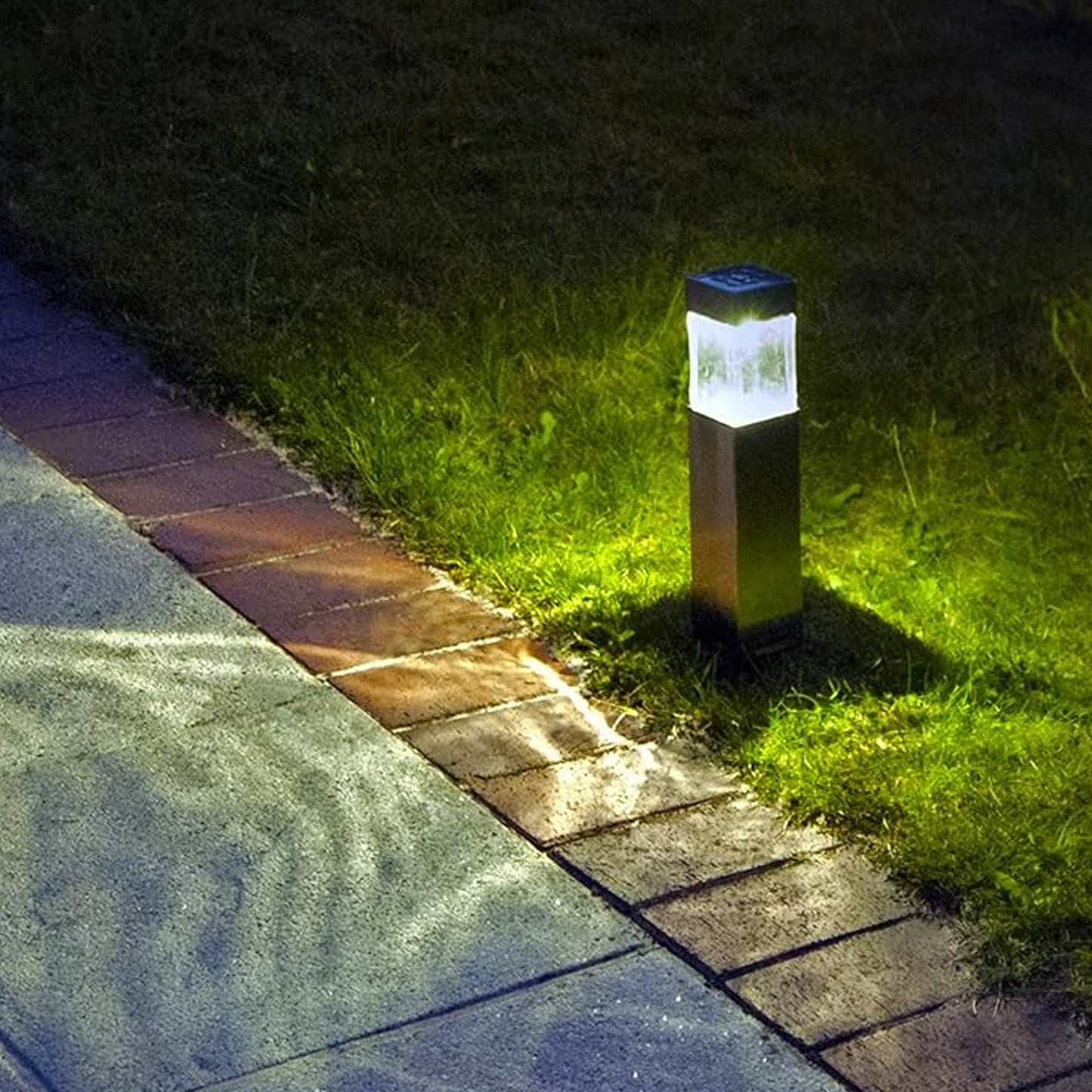 Wukusy outdoor garden solar light illuminating a garden pathway, ideal for driveways and outdoor garden decor.