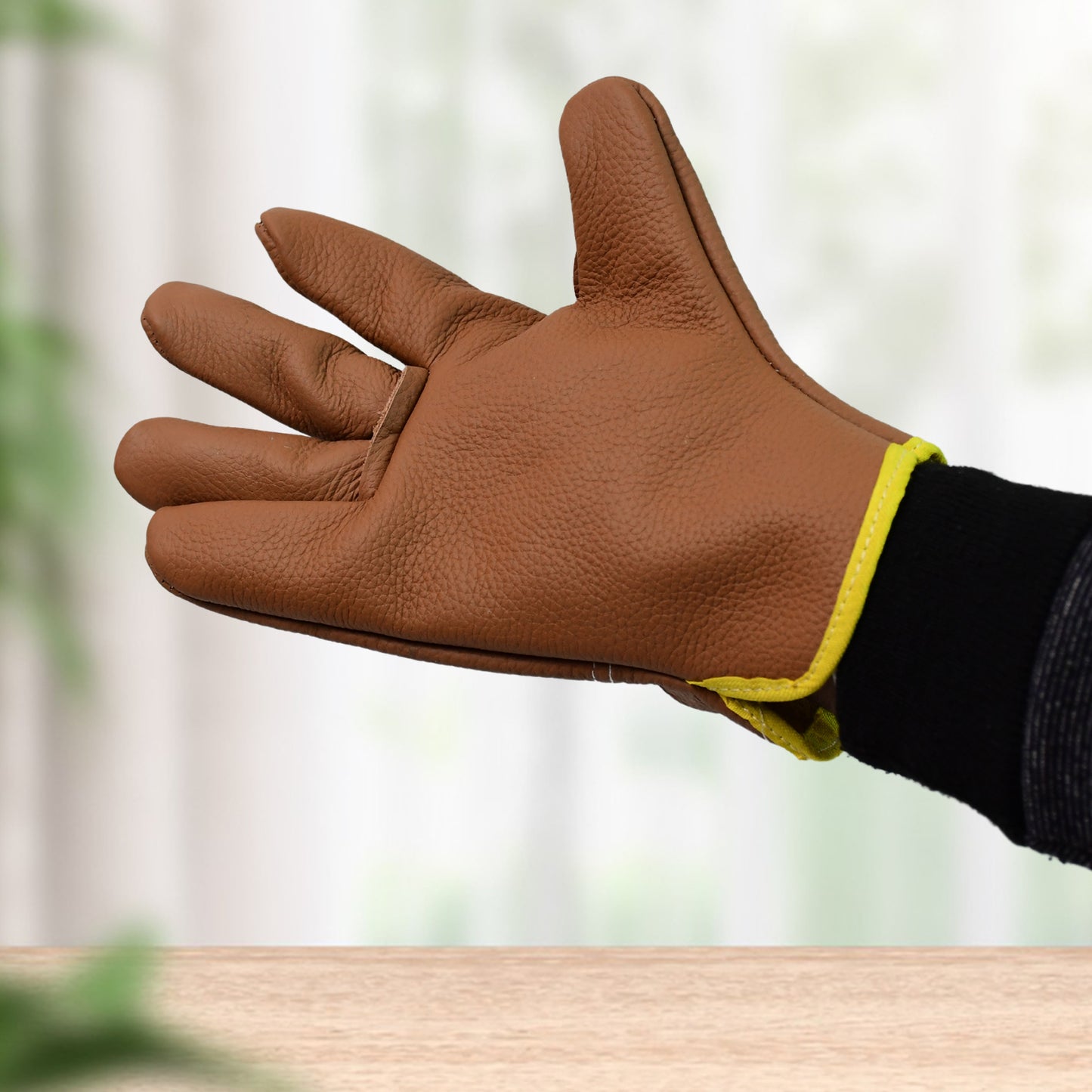 Pair of Wukusy gardening gloves for men and women, heavy-duty leather gloves for gardening tasks, shown in the image.