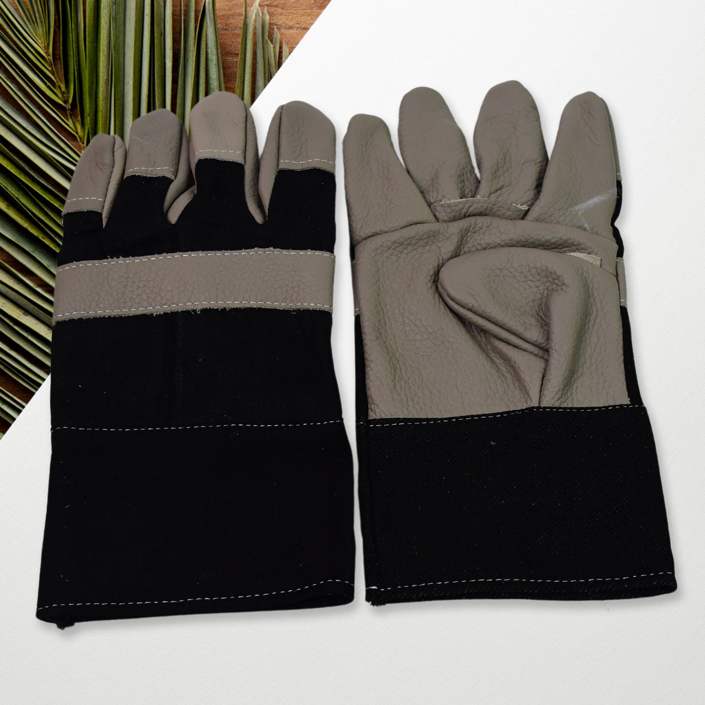 Pair of Wukusy gardening gloves for men and women, heavy-duty leather garden gloves for outdoor gardening tasks.