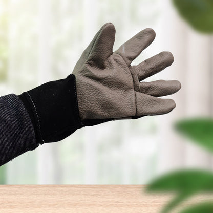 Pair of Wukusy gardening leather gloves for men and women, heavy-duty garden gloves for outdoor gardening tasks.