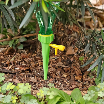 Wukusy green garden self-watering spikes for plants, single black plastic watering spike for efficient garden irrigation.