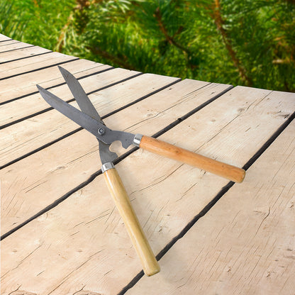 Heavy-duty B Grade hedge shear with wooden handle by Wukusy for trimming bushes and hedges in the garden.