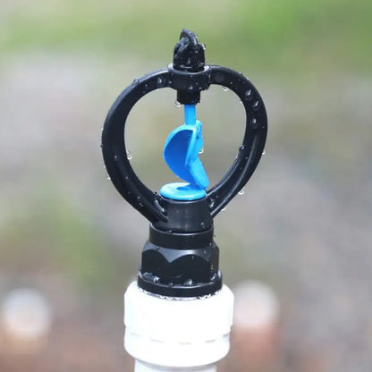 Wukusy garden rotating irrigation sprinkler with rain-shaped butterfly plastic spray nozzle for watering lawns and gardens.
