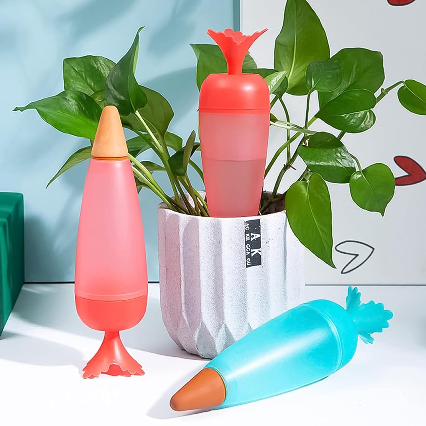 Wukusy garden self-watering spike and plant watering globe, automatic plant watering system in a natural outdoor setting.