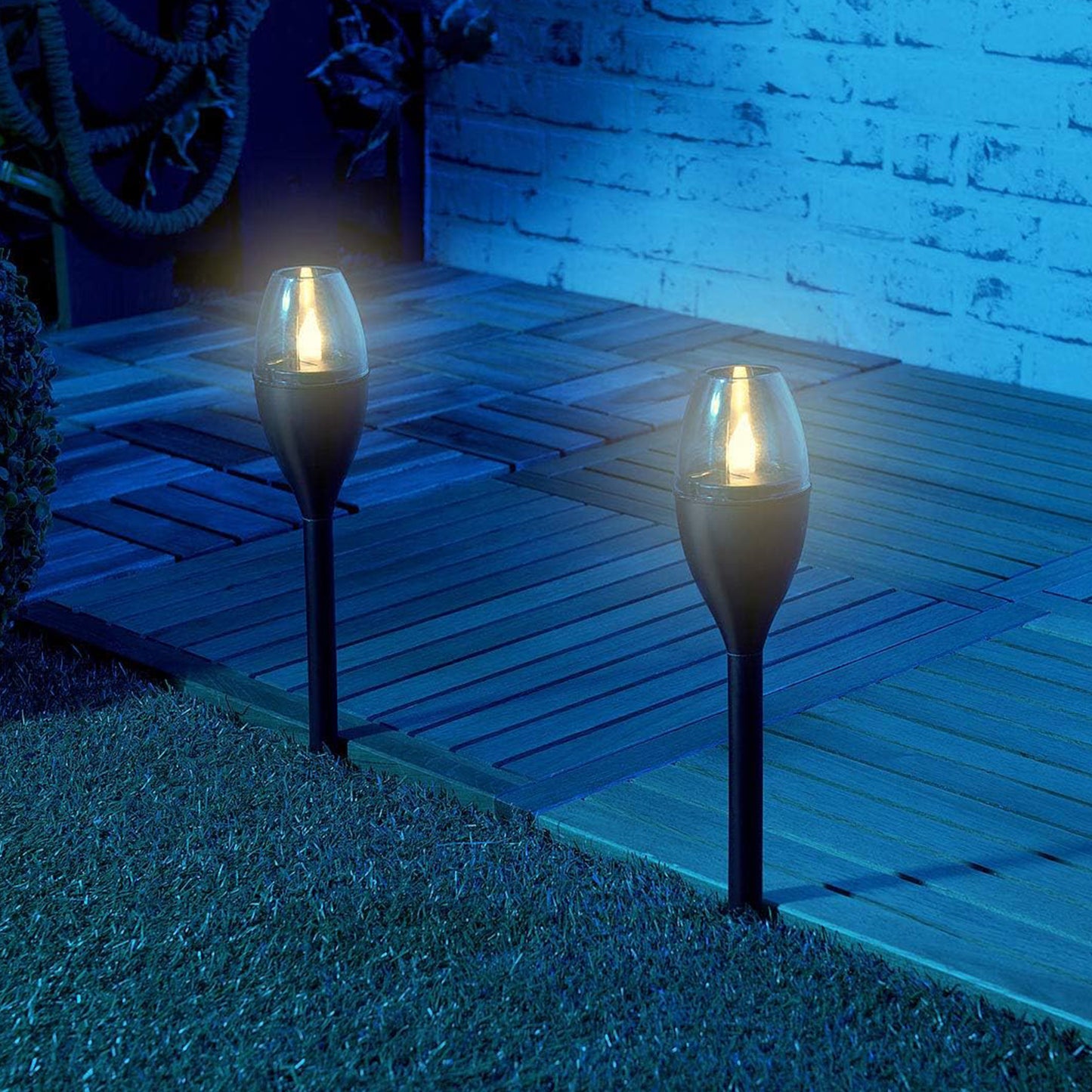 Wukusy solar-powered outdoor garden pathway light illuminating a garden path with a classic design and durable construction.