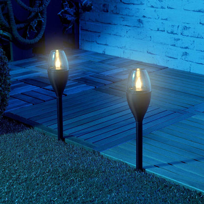 Wukusy solar-powered outdoor garden pathway light illuminating a garden path with a classic design and durable construction.
