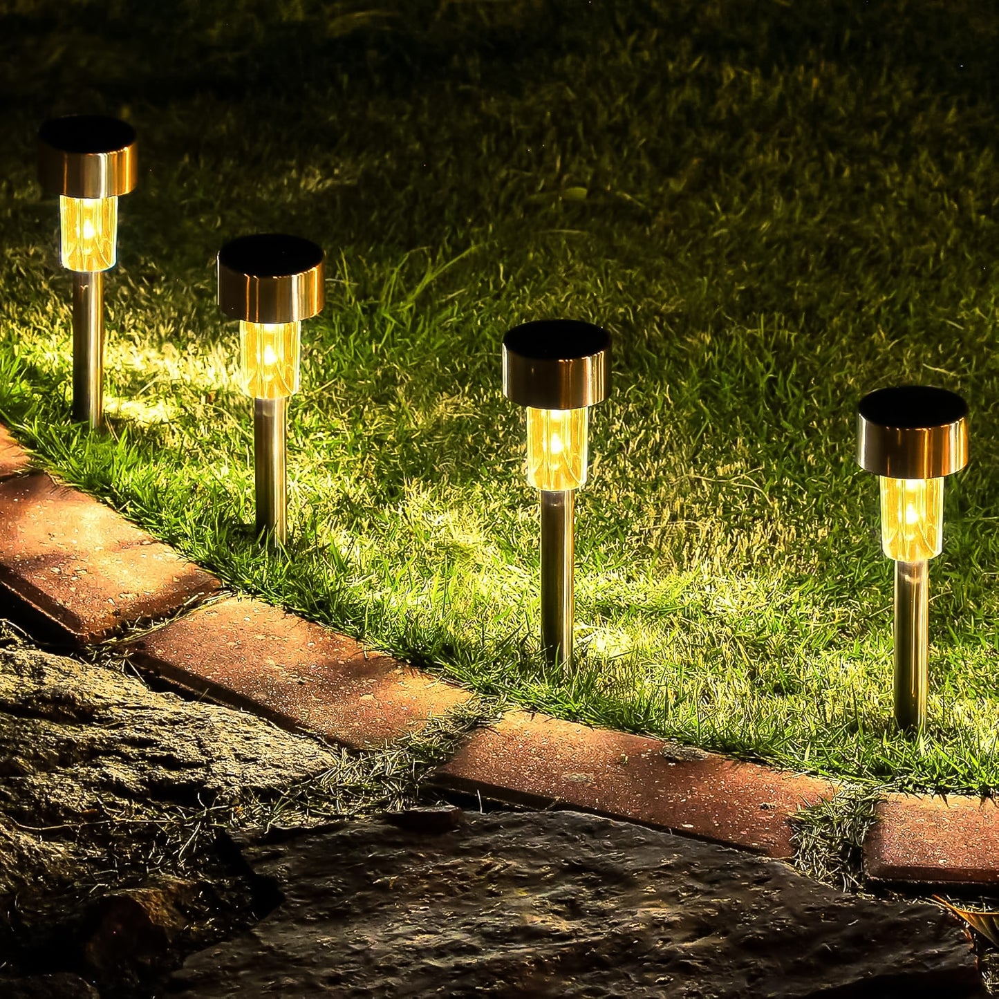 Set of two Wukusy solar-powered stainless steel garden pathway lights, 31x4 cm, for outdoor illumination.