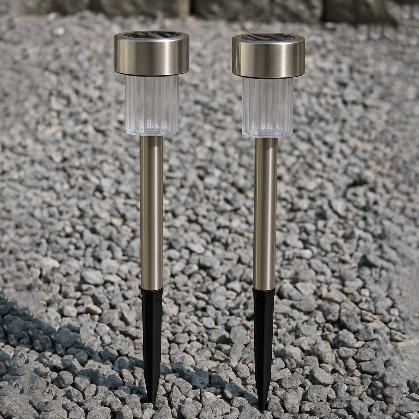Two Wukusy solar-powered stainless steel garden pathway lights, 31x4 cm, designed for outdoor garden illumination.