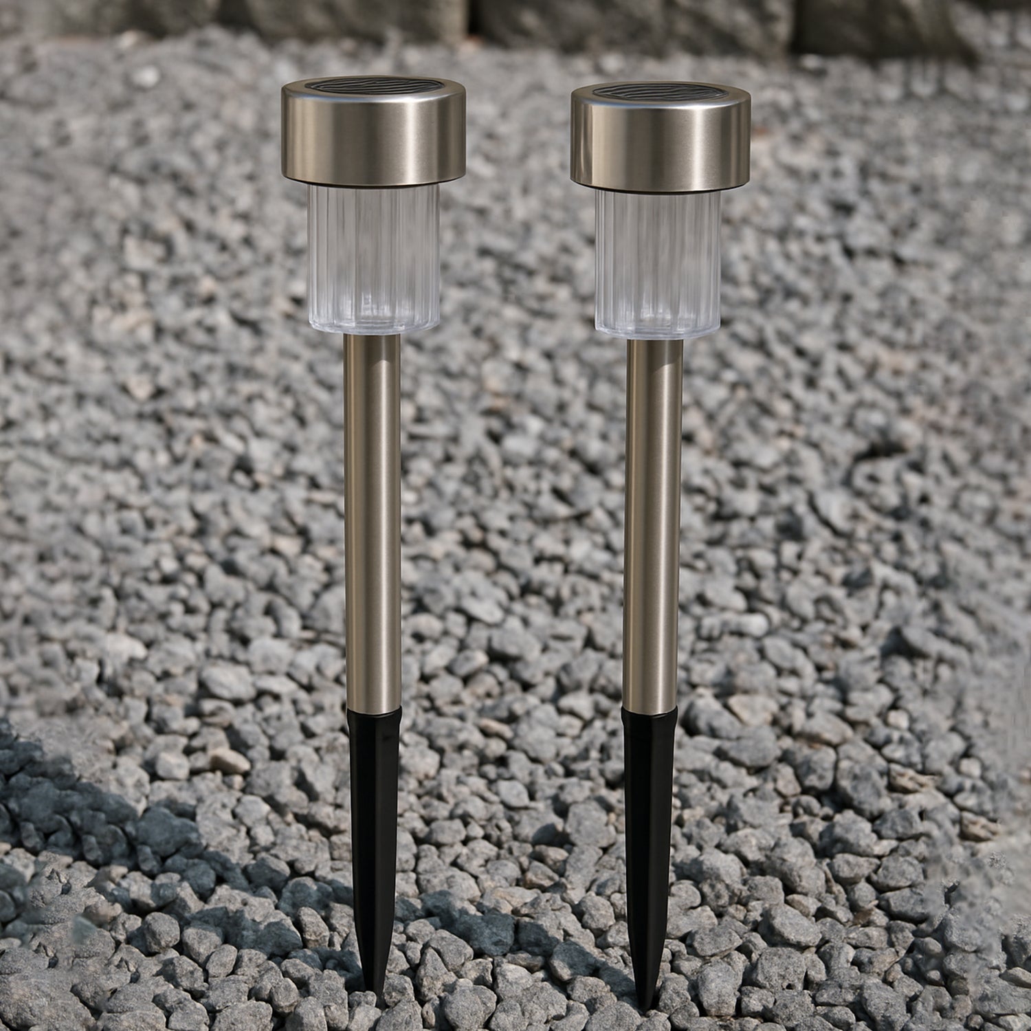 Two Wukusy solar-powered stainless steel garden pathway lights, 31x4 cm, designed for outdoor garden illumination.