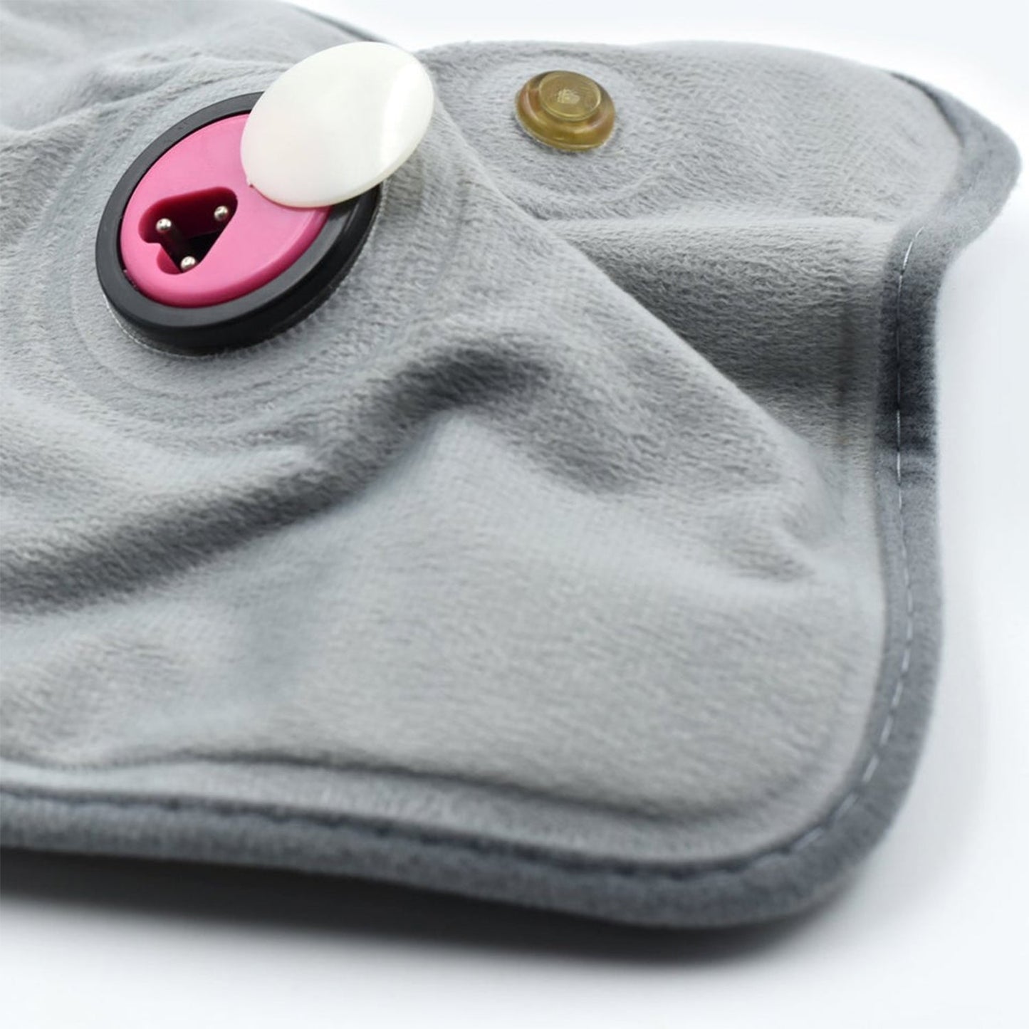 Wukusy heating bag and heating pad for pain relief in joints, muscles, and soft tissues, shown in use with a soft fabric cover.