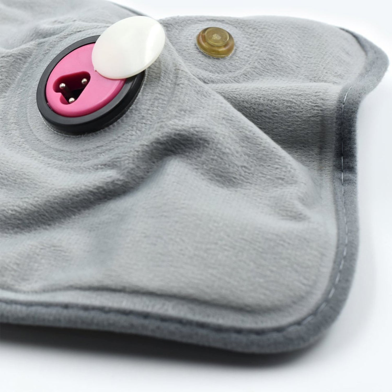 Wukusy heating bag and heating pad for pain relief in joints, muscles, and soft tissues, shown in use with a soft fabric cover.