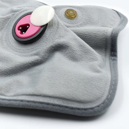 Wukusy heating bag and heating pad for pain relief in joints, muscles, and soft tissues, shown in use with a soft fabric cover.