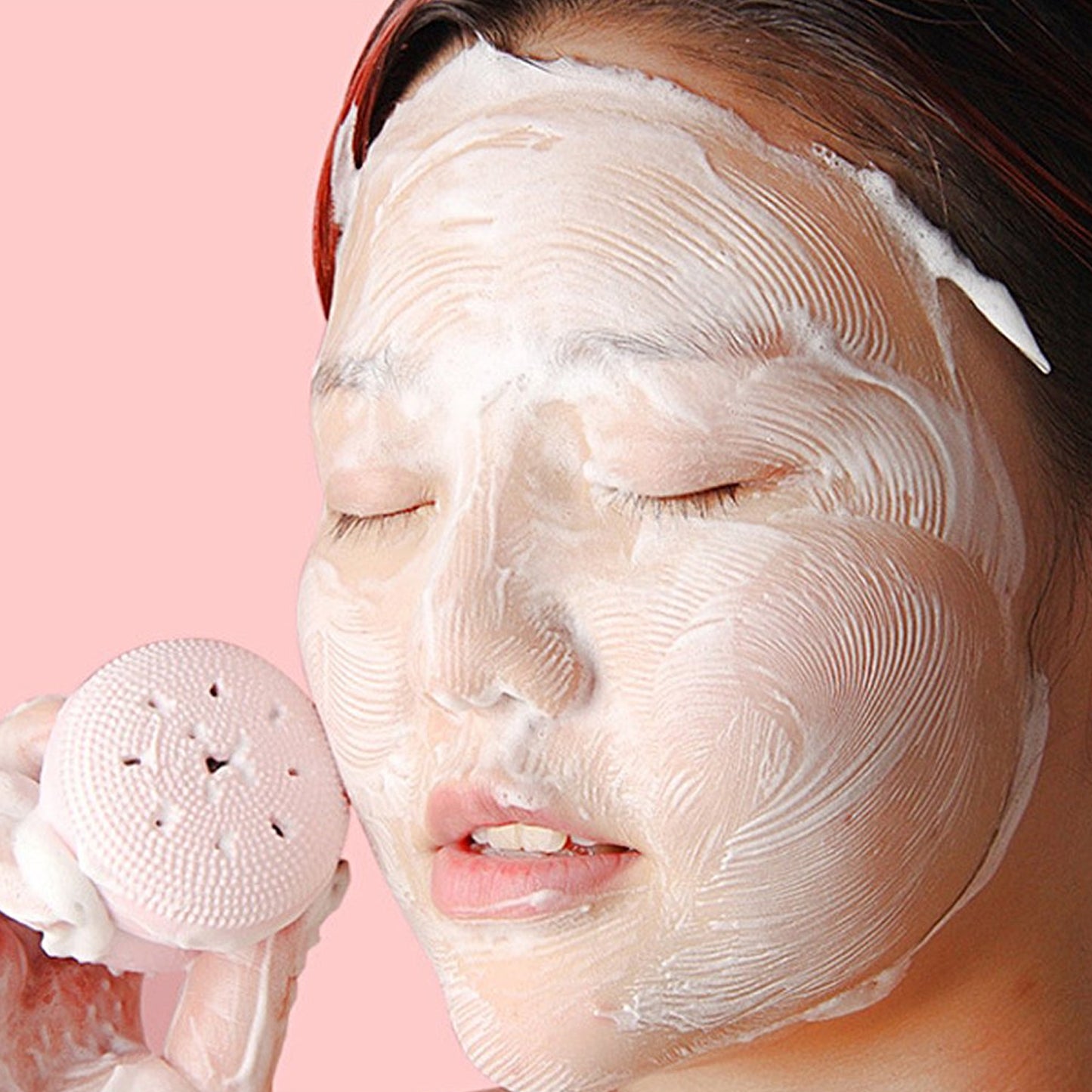 Wukusy facial cleansing brush featuring a cute octopus-shaped silicone face scrubber and skincare massager in a playful design.