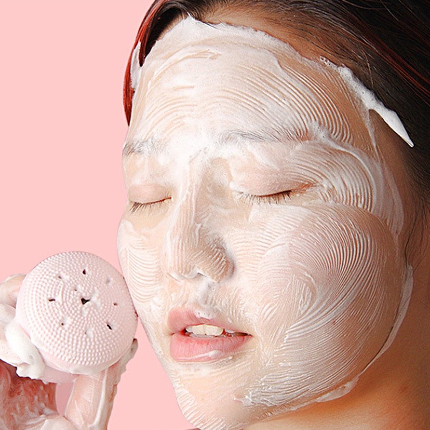 Wukusy facial cleansing brush featuring a cute octopus-shaped silicone face scrubber and skincare massager in a playful design.
