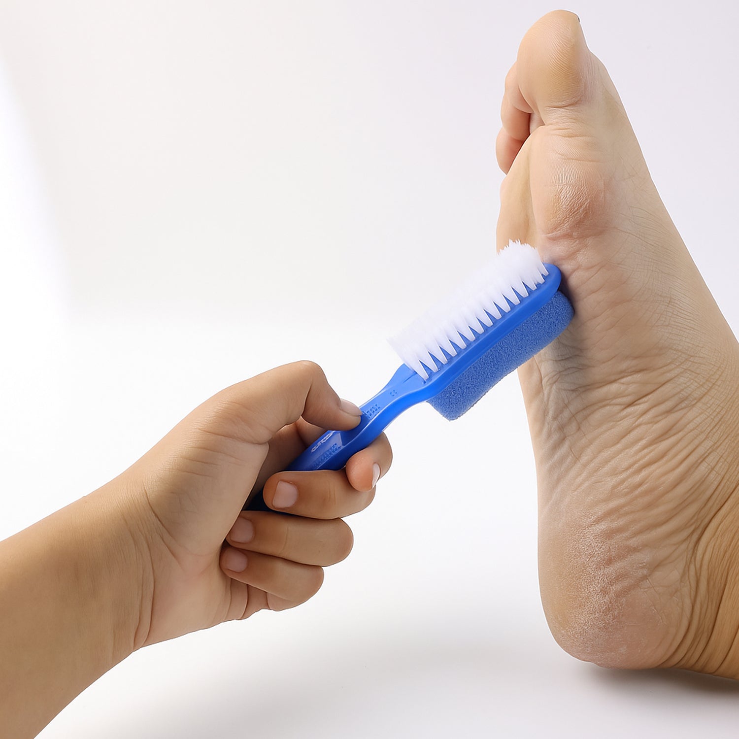 Wukusy 2-in-1 foot scrubber brush with pumice stone for exfoliating and cleaning feet, suitable for health and beauty routines.