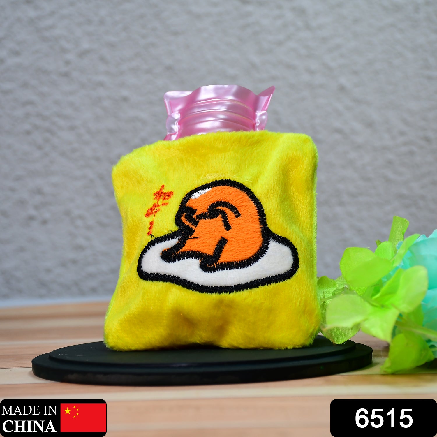 Yellow duck head small hot water bag by Wukusy with cover, used for pain relief, neck, shoulder, hand, feet warmth, and menstrual cramps.