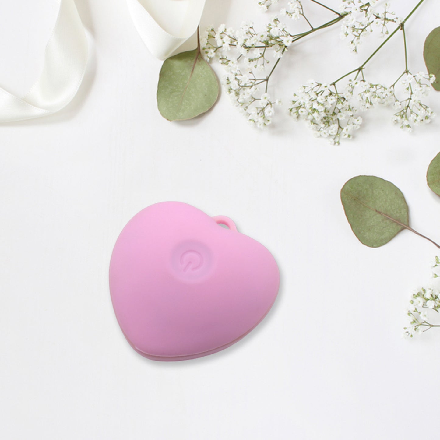 Heart-shaped waterproof facial cleansing brush by Wukusy, silicone face scrubber for deep skin cleansing and exfoliation.