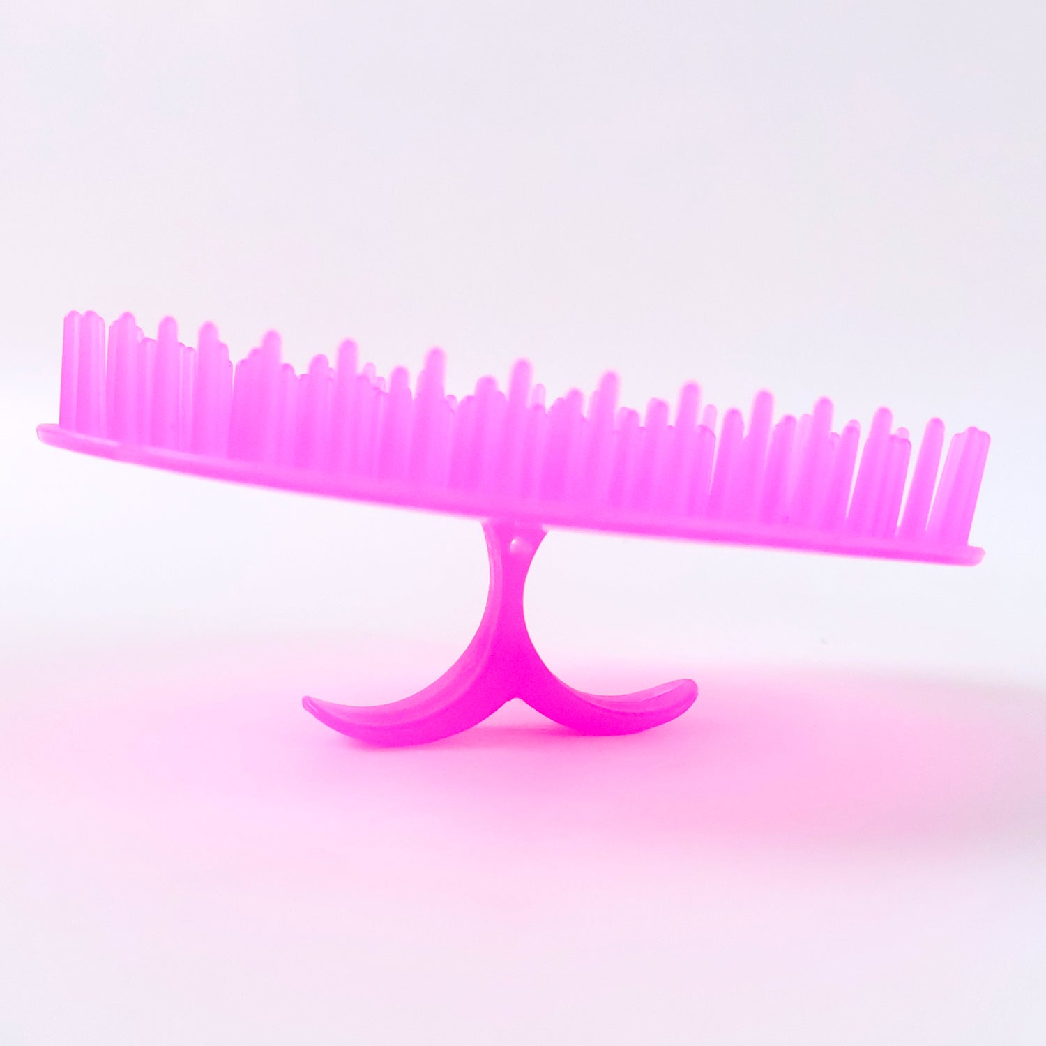 Wukusy ergonomic plastic scalp massager and shampoo brush, designed for gentle scalp cleansing and massage.