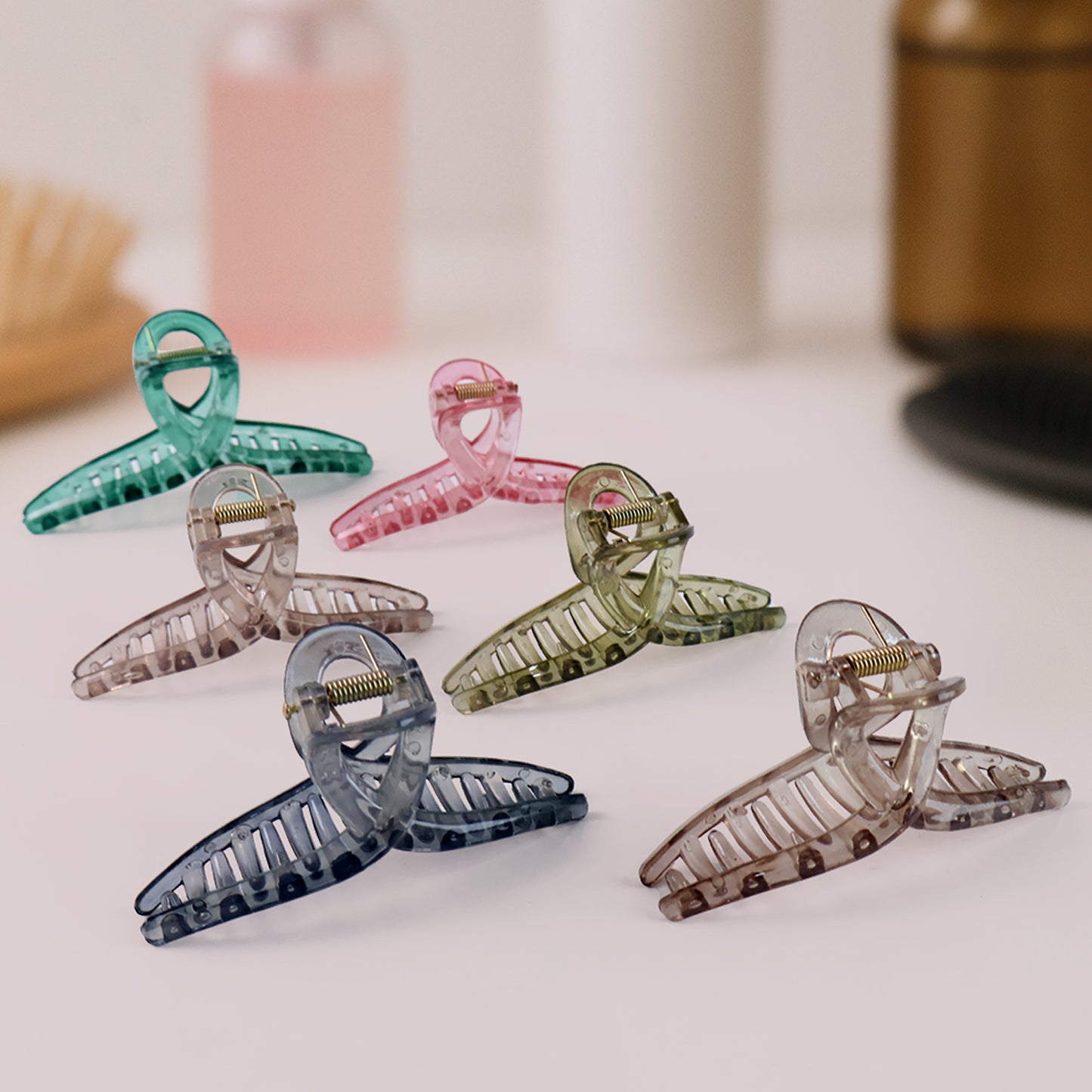 Set of 12 multicolor Wukusy hair clutcher clips with mixed designs for securing hair in stylish, colorful fashion.