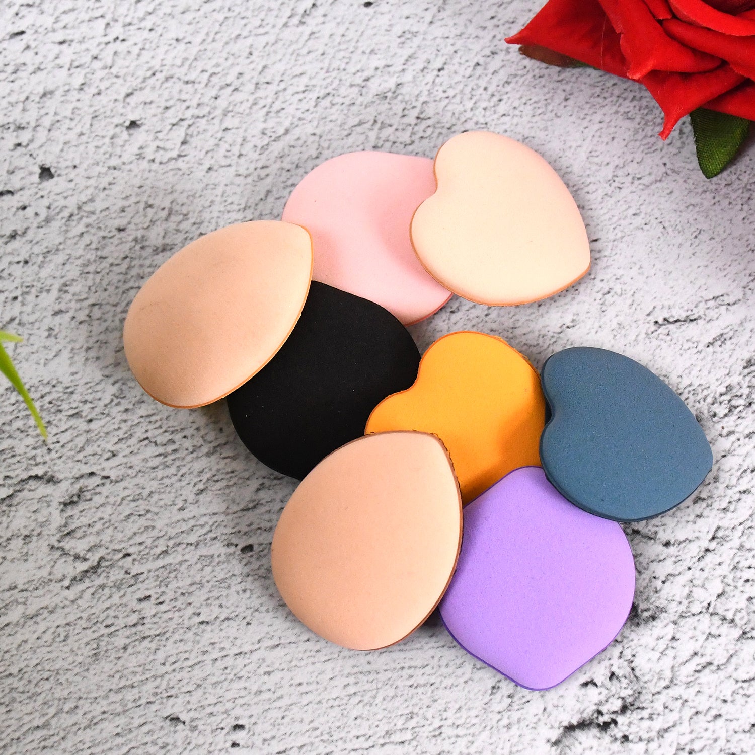 Set of 8 multicolour mini finger makeup powder puffs from Wukusy, perfect for applying face powders and blending makeup.