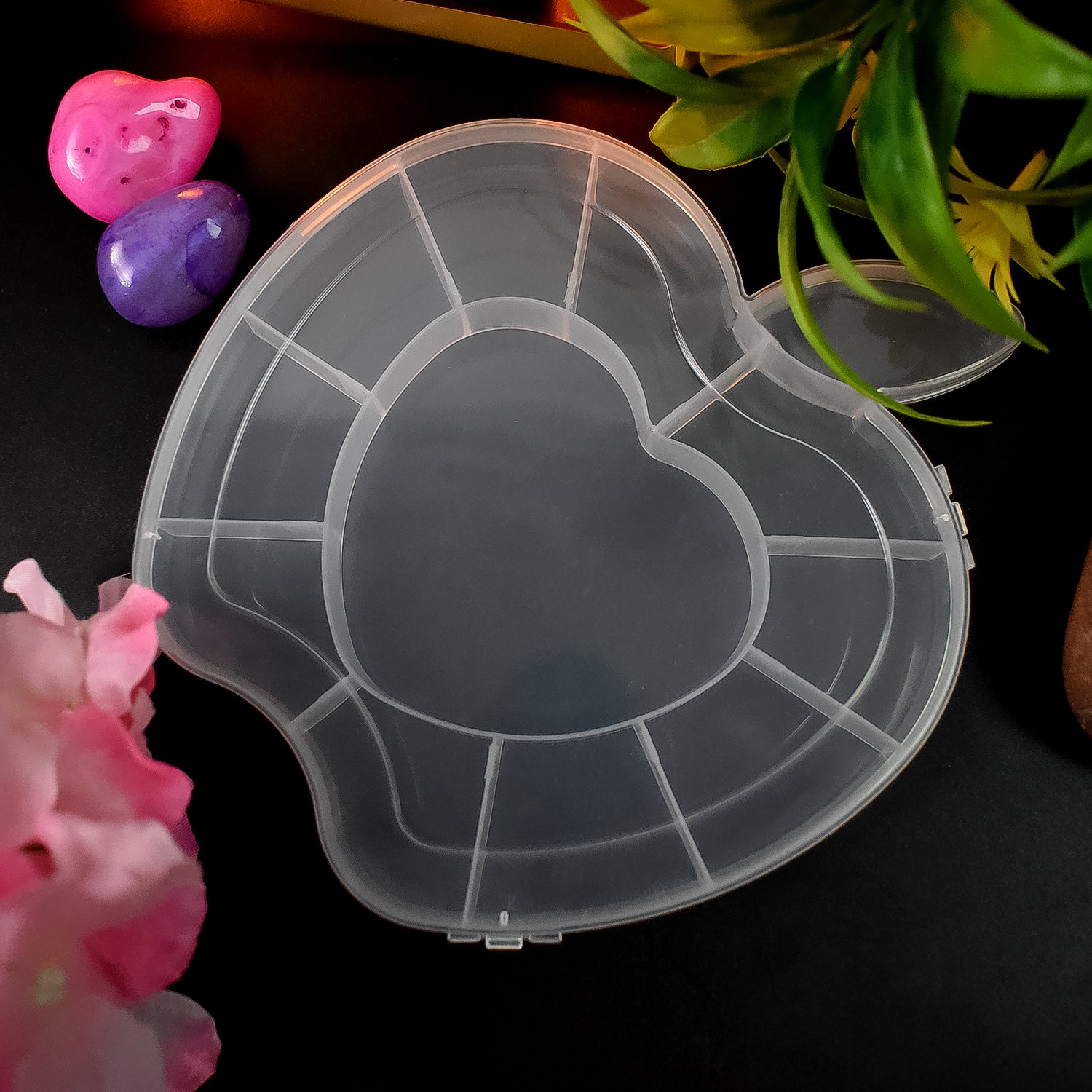 Wukusy plastic apple-shaped jewelry storage box for organizing earrings, rings, and small accessories.
