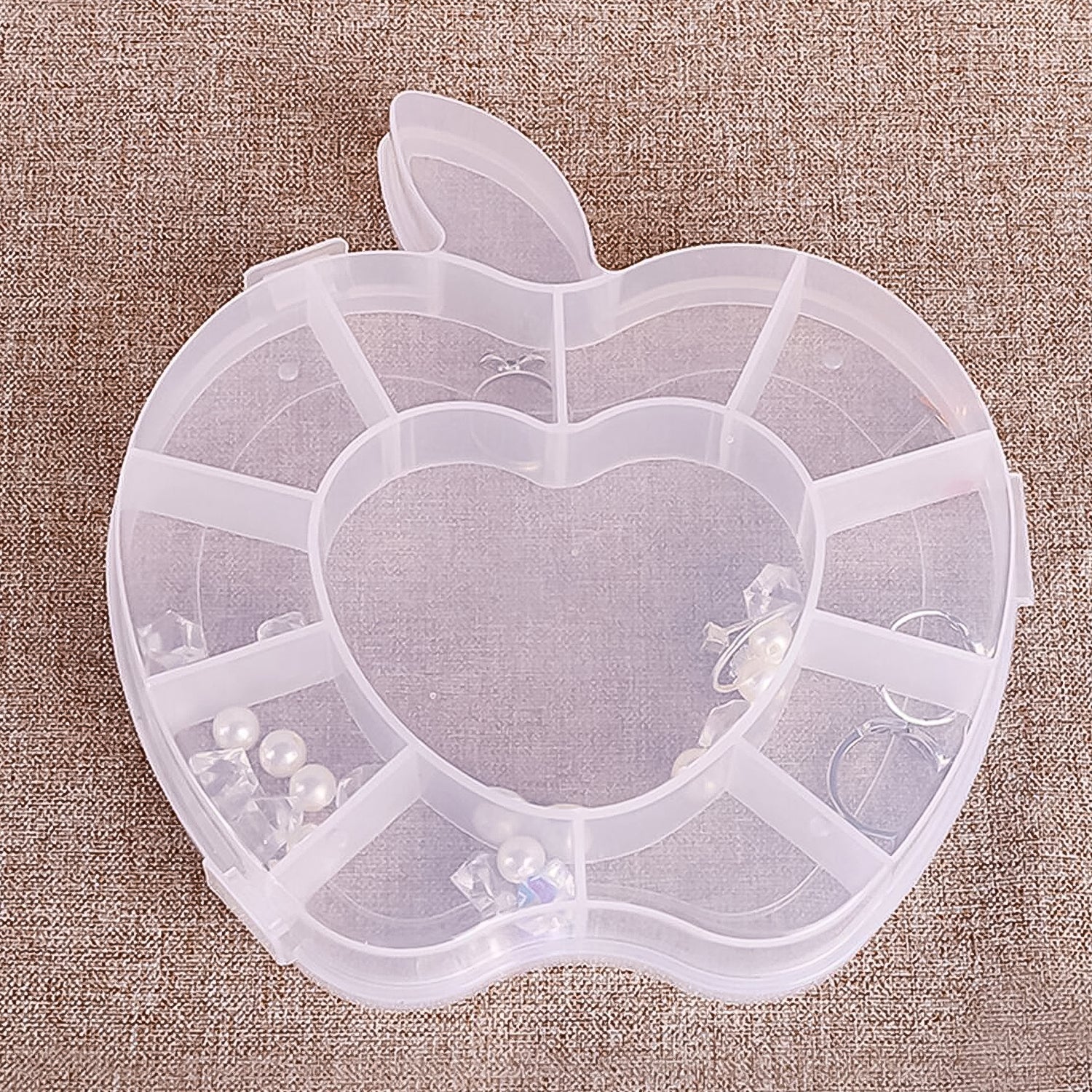 Wukusy plastic apple-shaped jewelry storage box for organizing rings and small accessories, ideal for health and beauty use.