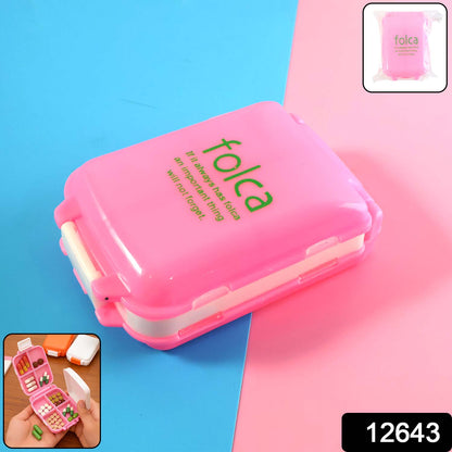 Pink dual-sided portable pill organizer box by Wukusy, compact health and beauty storage for pills and supplements.