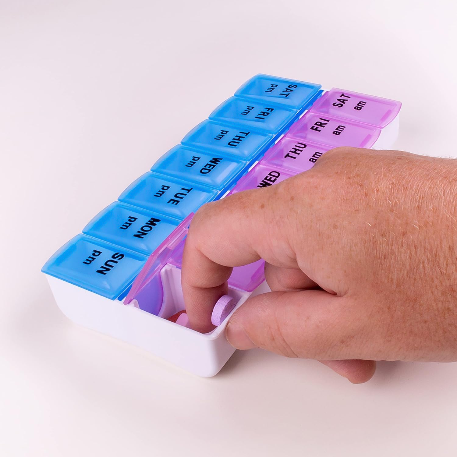 Wukusy weekly medicine pill organizer with seven compartments for daily medication management.
