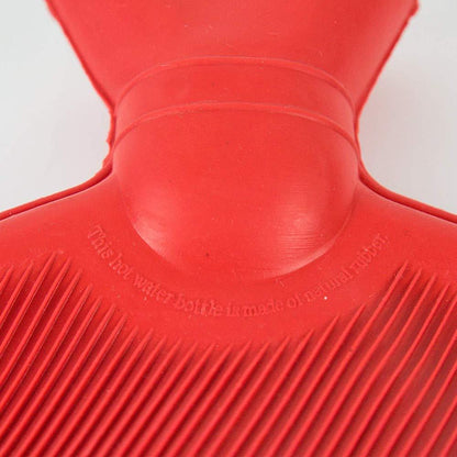Medium Wukusy rubber hot water heating pad for pain relief, shown in a healthcare setting with a textured surface.