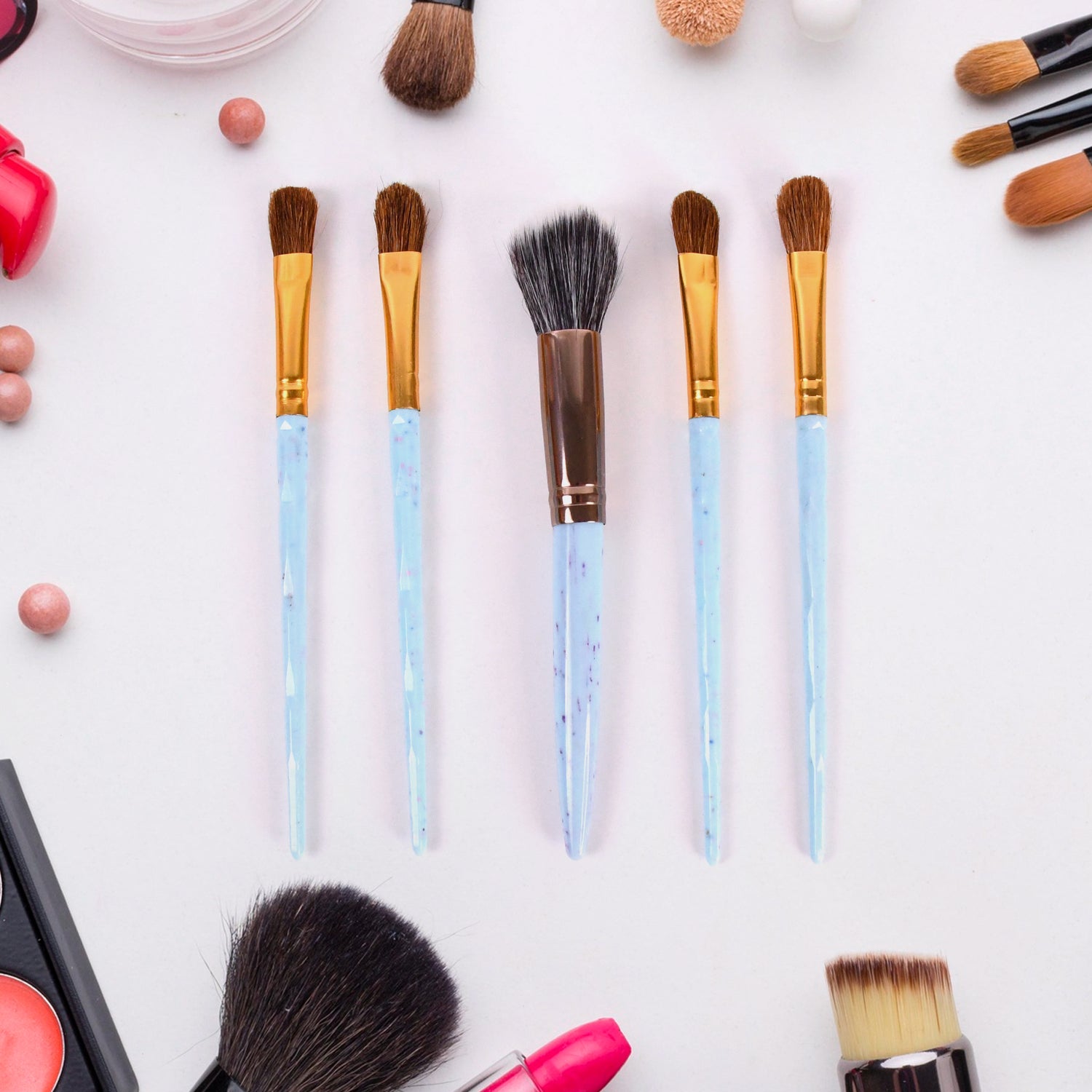 Wukusy 5-piece makeup brush tools kit with mixed color handles, includes various brushes for applying makeup and skincare.