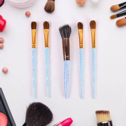 Wukusy 5-piece makeup brush tools kit with mixed color handles, includes various brushes for applying makeup and skincare.