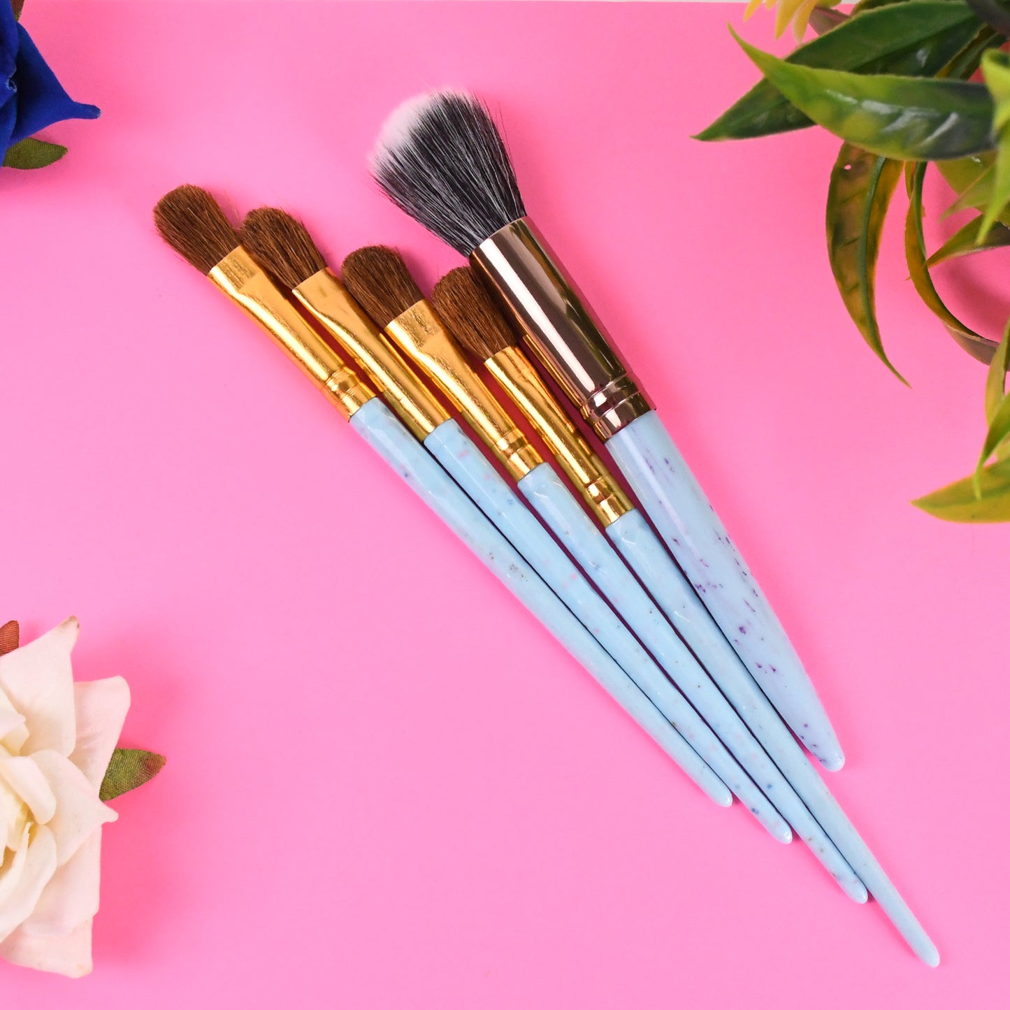 Wukusy 5-piece makeup brush tools kit with mixed color handles, including various brushes for face and eye makeup application.