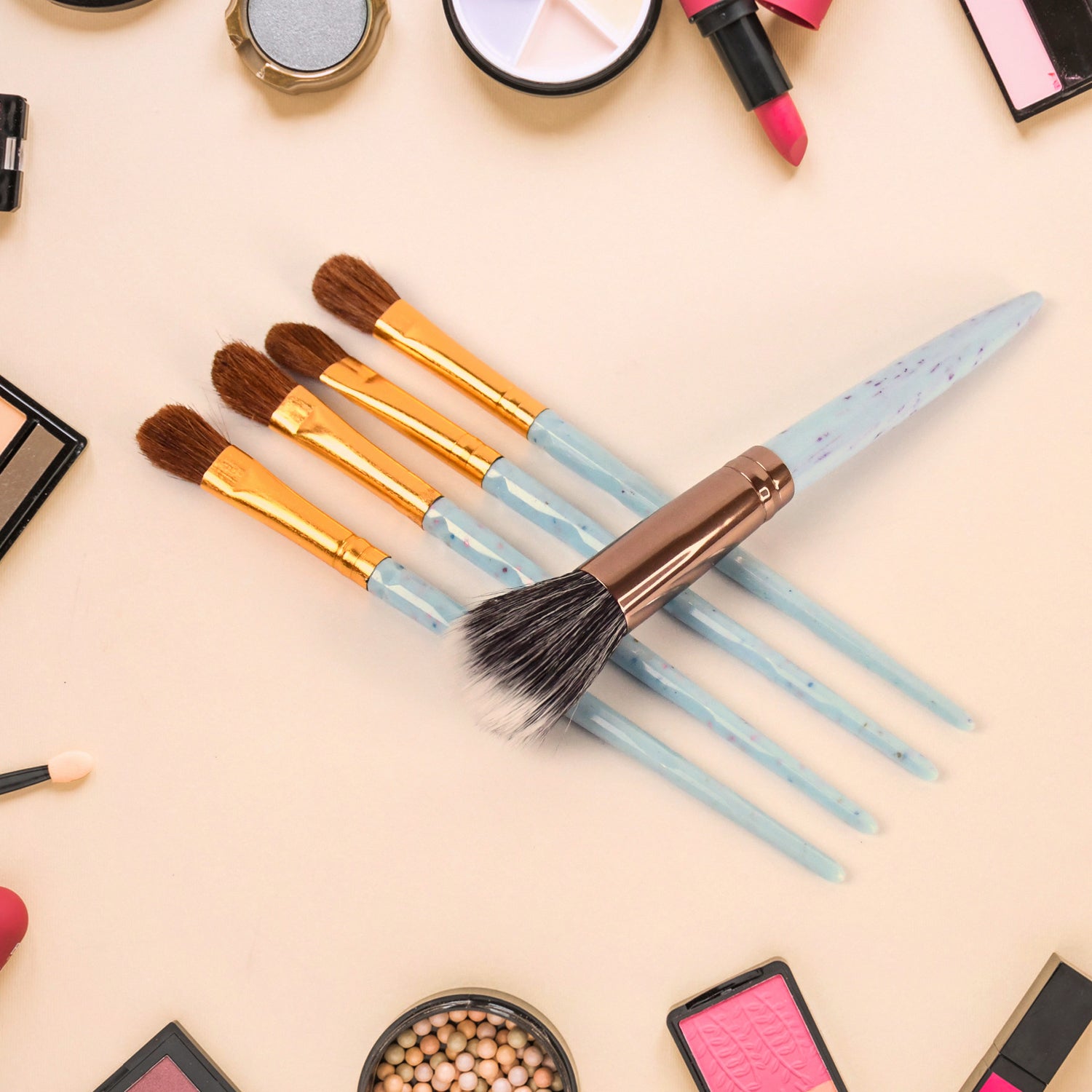 Wukusy 5-piece makeup brush tools kit with mixed color handles, including various brushes for cosmetic application and blending.