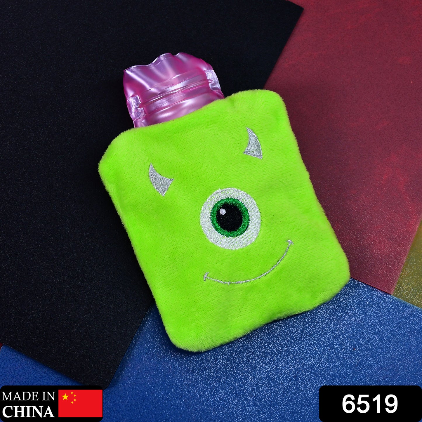Green Wukusy One Eye Monster print small hot water bag with cover for pain relief, neck, shoulder, hand, foot warmth, and menstrual cramps.