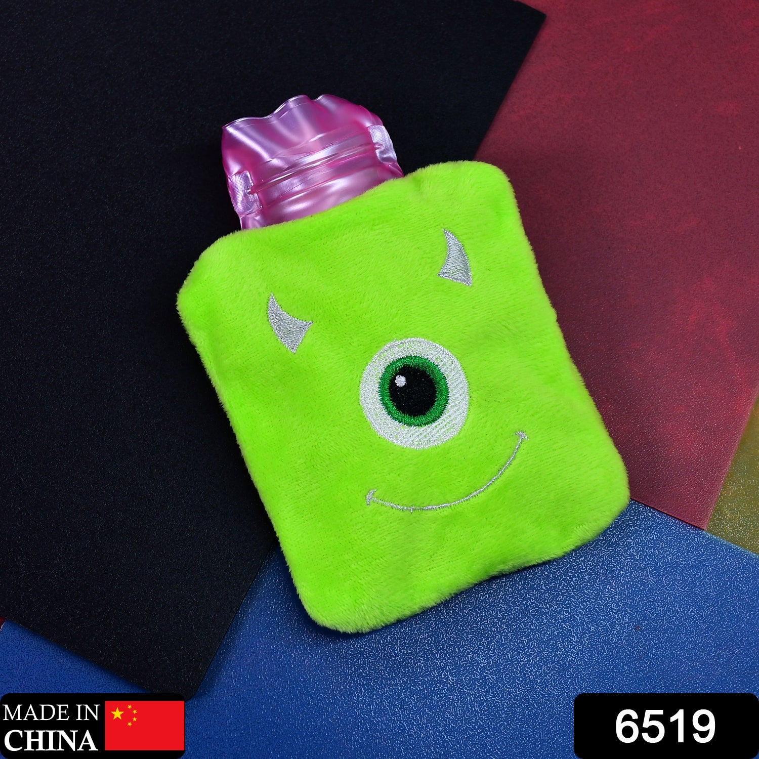 Green Wukusy One Eye Monster print small hot water bag with cover for pain relief, neck, shoulder, hand, foot warmth, and menstrual cramps.