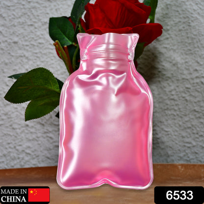 Pink Wukusy small hot water bag with cover, used for pain relief, neck, shoulder, hand, foot warming, and menstrual cramps.