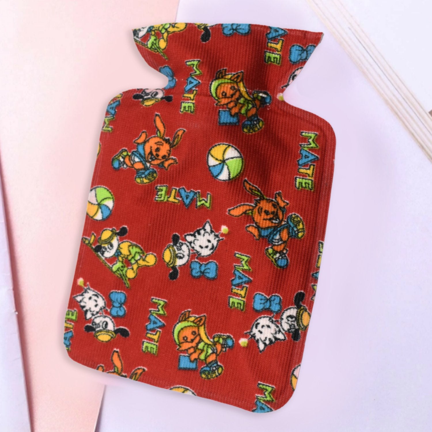 Small Wukusy rubber hot water heating pad bag for pain relief, designed for personal care and soothing warmth.