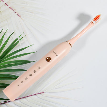 Wukusy electric toothbrush for adults and teens with deep cleaning and extra brush heads, shown with multiple brushing heads attached.
