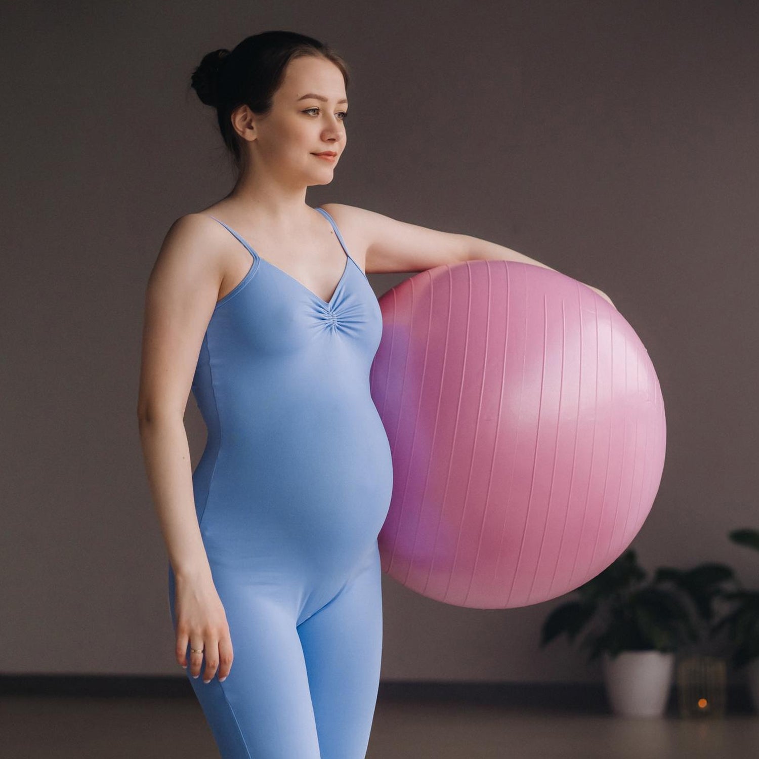 Wukusy 65cm anti-burst exercise ball with inflation pump, non-slip gym ball for yoga, Pilates, and core training at home or gym.